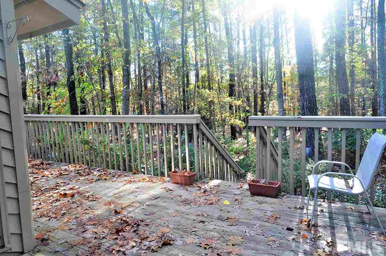 6 Pinnacle Road Durham, NC 27705 - Photo 19 of 24 a view of a chair and tables in the balcony