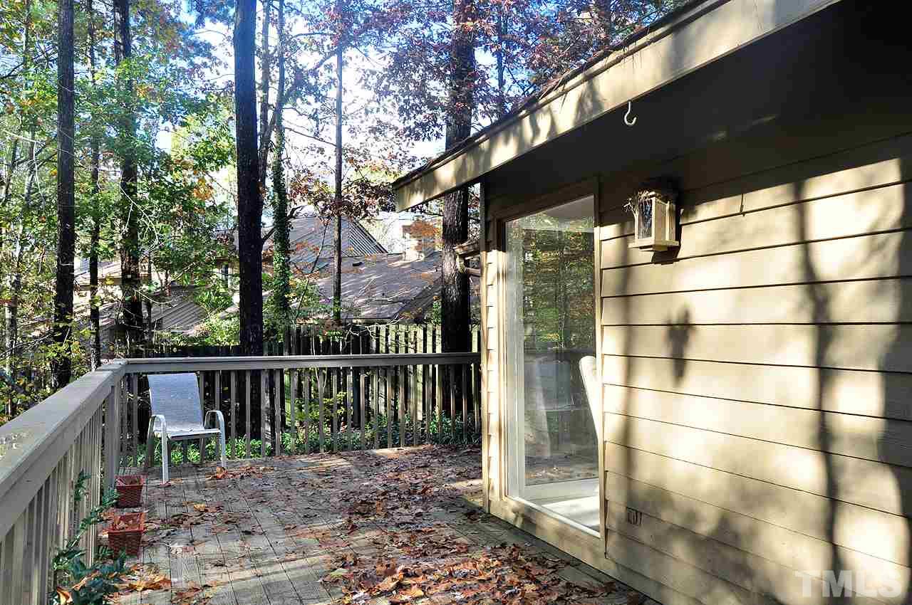 6 Pinnacle Road Durham, NC 27705 - Photo 21 of 24 a view of a building with a floor to ceiling window and wooden fence