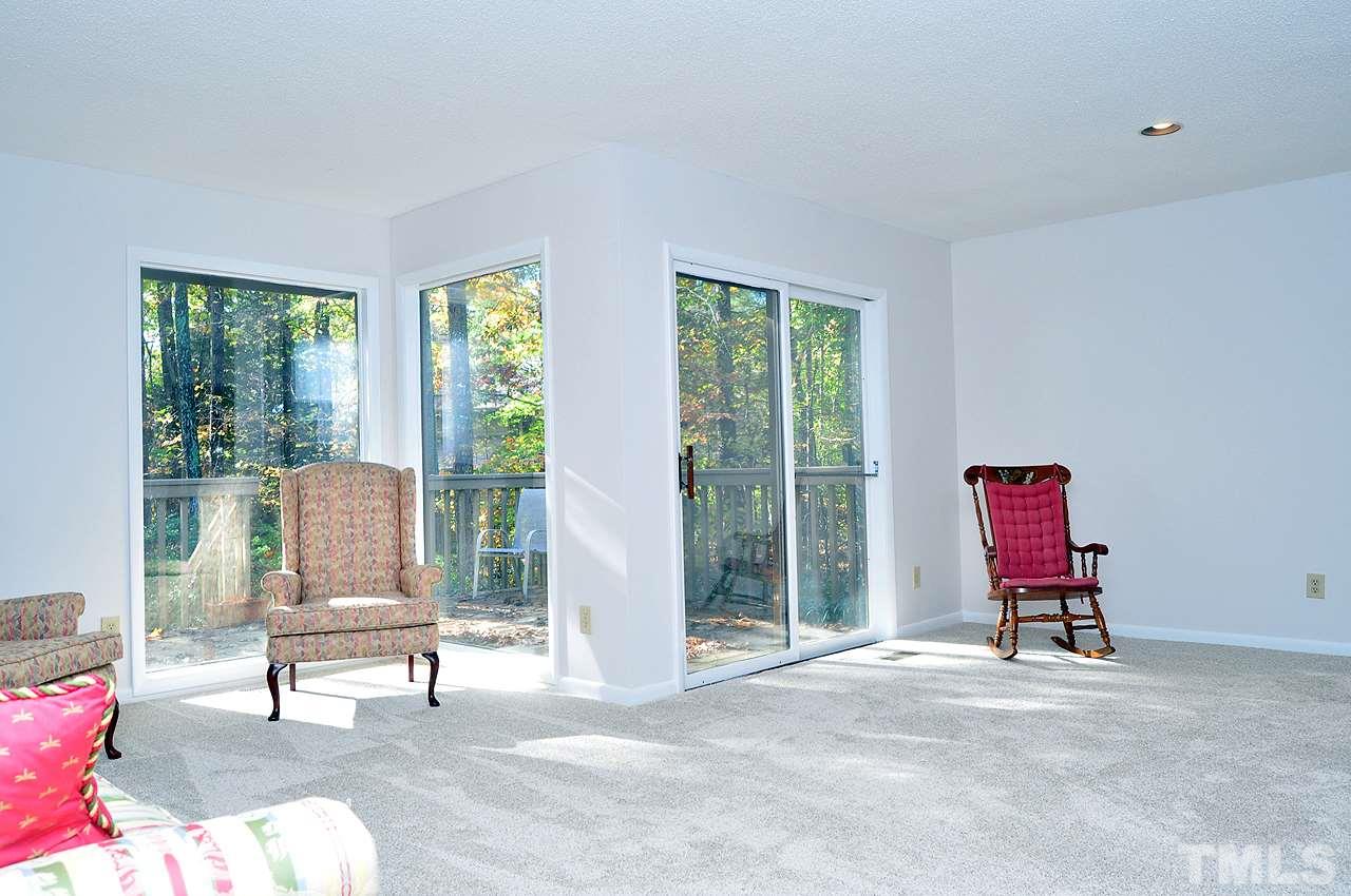 6 Pinnacle Road Durham, NC 27705 - Photo 9 of 24 a living room with furniture and floor to ceiling window