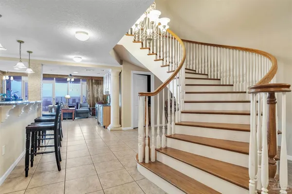 a large kitchen with stainless steel appliances granite countertop a large stove a sink dishwasher and cabinets with wooden floor