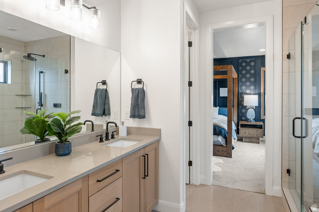 11617 South Wildrye Field Way Draper, UT 84020 - Photo 22 of 53 Ensuite primary bathroom featuring a large stall shower, double vanity, and light tile patterned floors