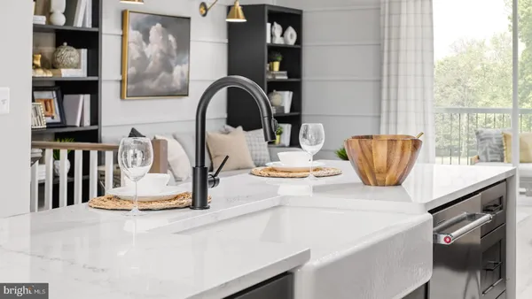 a kitchen with a sink a stove and a dining table