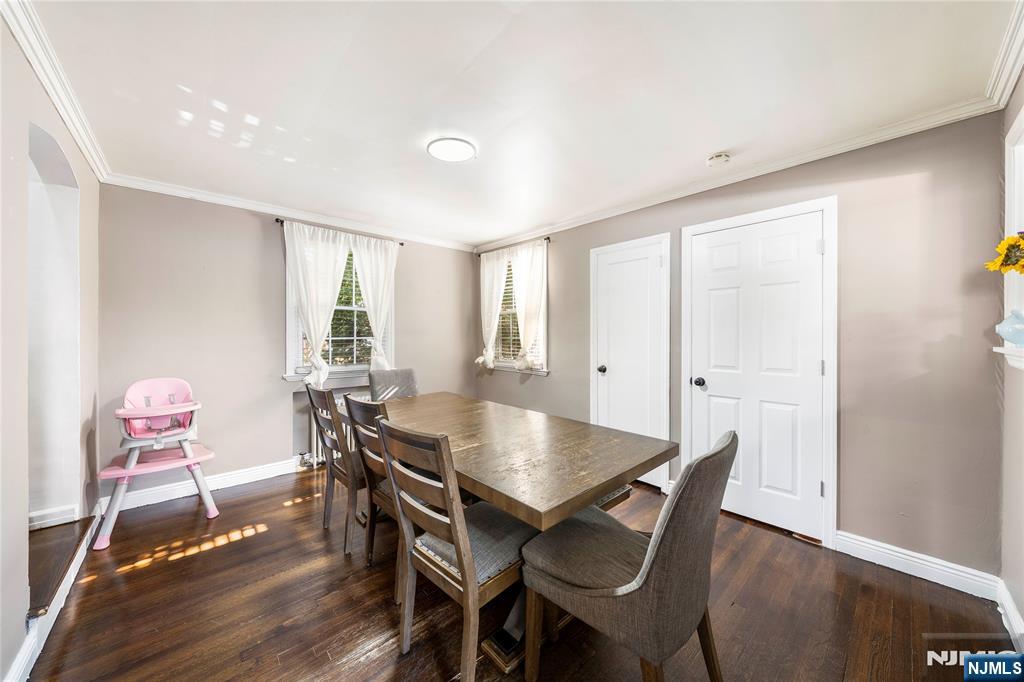 124 Hazley Avenue Rochelle Park, NJ 07662 - Photo 11 of 33 a view of a dining room with furniture and wooden floor