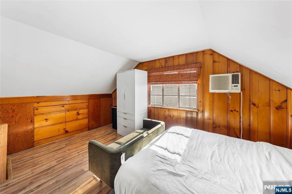 124 Hazley Avenue Rochelle Park, NJ 07662 - Photo 14 of 33 a bedroom with a bed and wooden floor