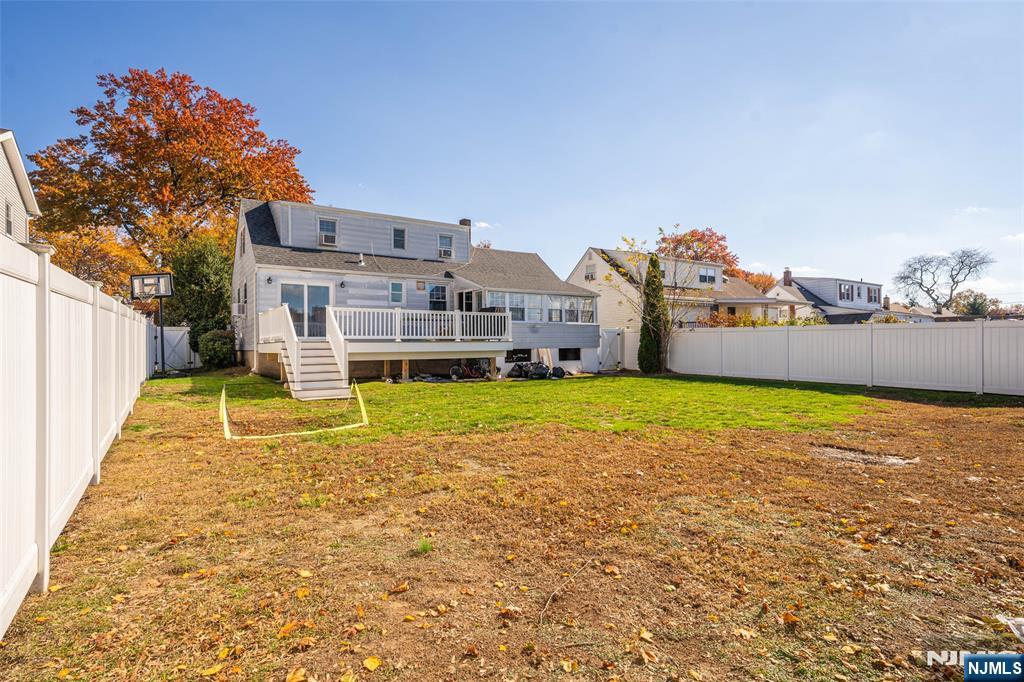 124 Hazley Avenue Rochelle Park, NJ 07662 - Photo 27 of 33 a view of a house with a yard and sitting area