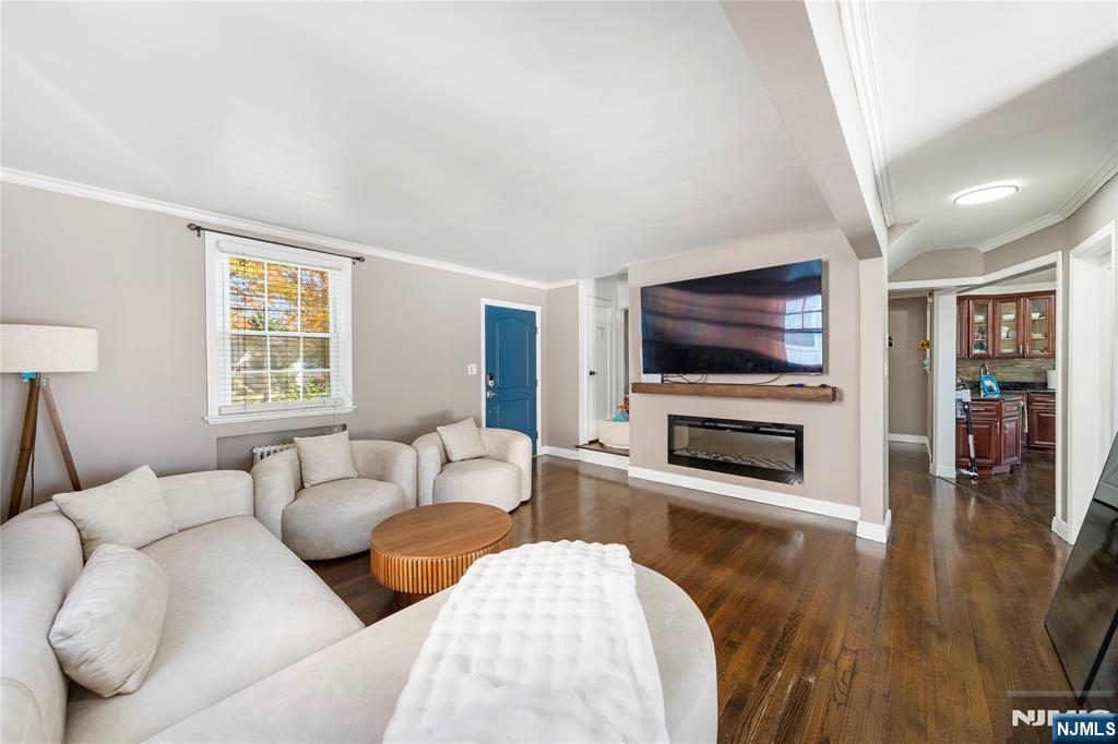 124 Hazley Avenue Rochelle Park, NJ 07662 - Photo 4 of 33 a living room with furniture and a flat screen tv
