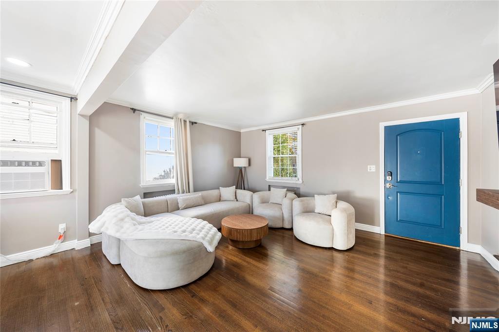 124 Hazley Avenue Rochelle Park, NJ 07662 - Photo 5 of 33 a living room with furniture and wooden floor
