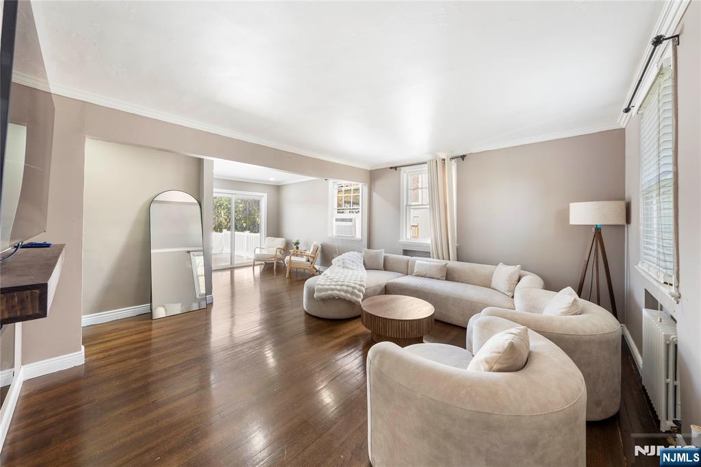 124 Hazley Avenue Rochelle Park, NJ 07662 - Photo 6 of 33 a living room with furniture and a large window