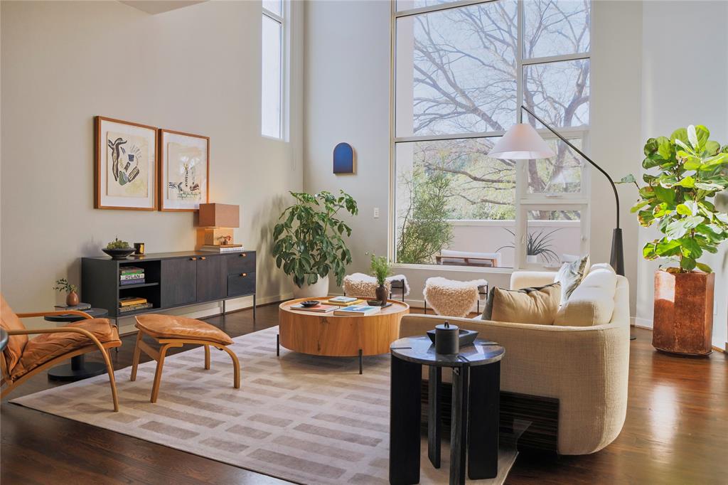 4026 Travis Street, Unit E Dallas, TX 75204 - Photo 1 of 19 a living room with furniture and a potted plant