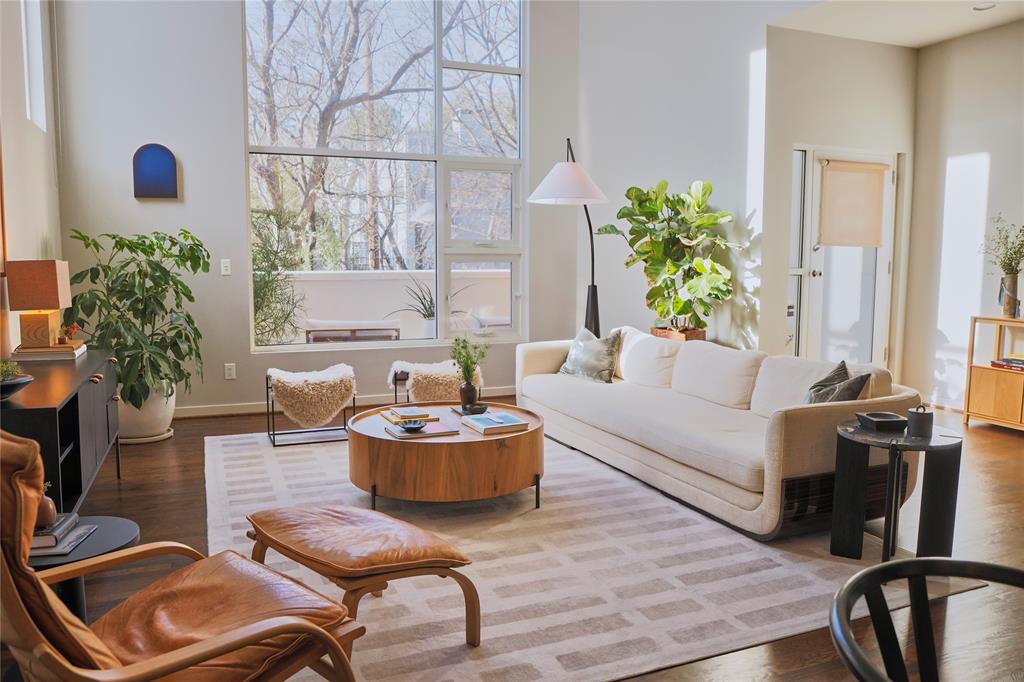 4026 Travis Street, Unit E Dallas, TX 75204 - Photo 5 of 19 a living room with furniture and a potted plant