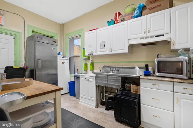 a kitchen with a stove and a refrigerator