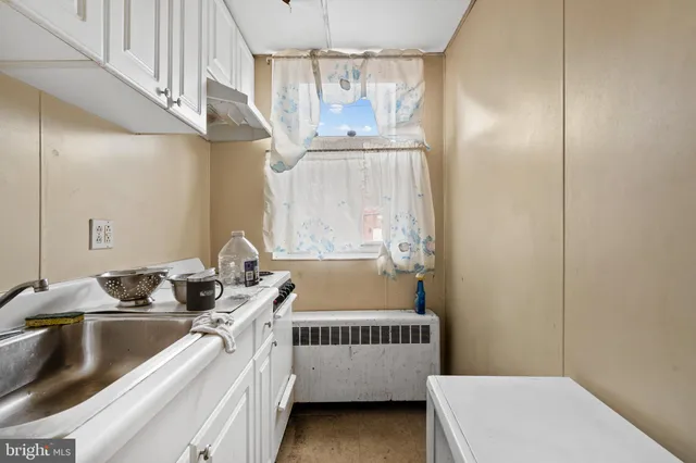 a bathroom with a sink and a window