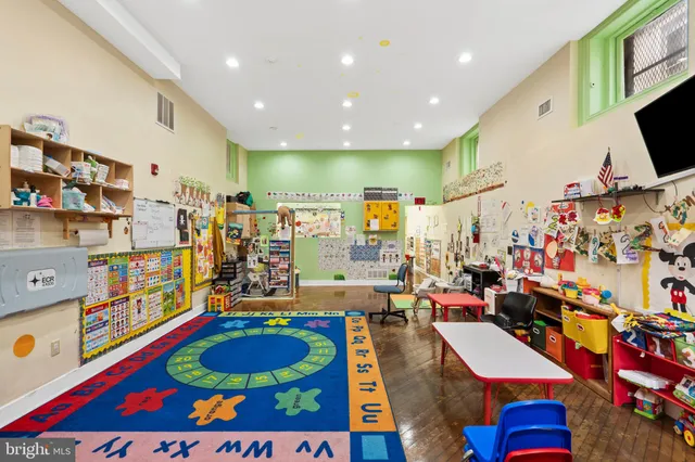 a very nice looking room with lots of stuff and toys