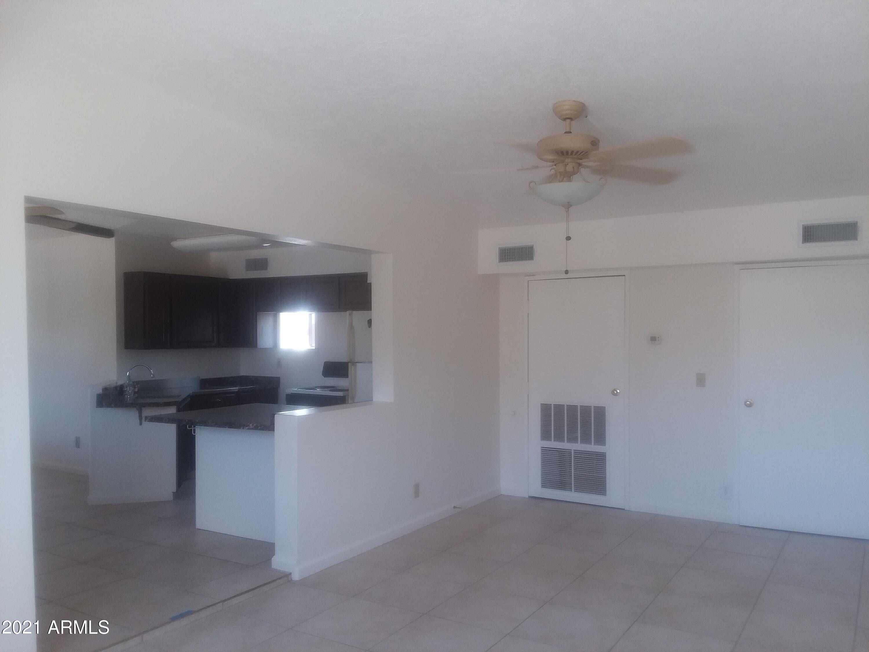 1244 North Boyd Road Apache Junction, AZ 85119 - Photo 19 of 36 Boyd livingroom toward kitchen