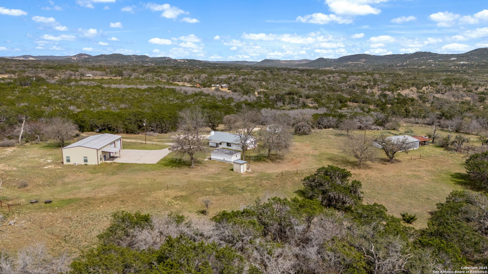 3584 Privilege Creek Road Pipe Creek, TX 78063 - Photo 15 of 66 a view of a lake with a mountain