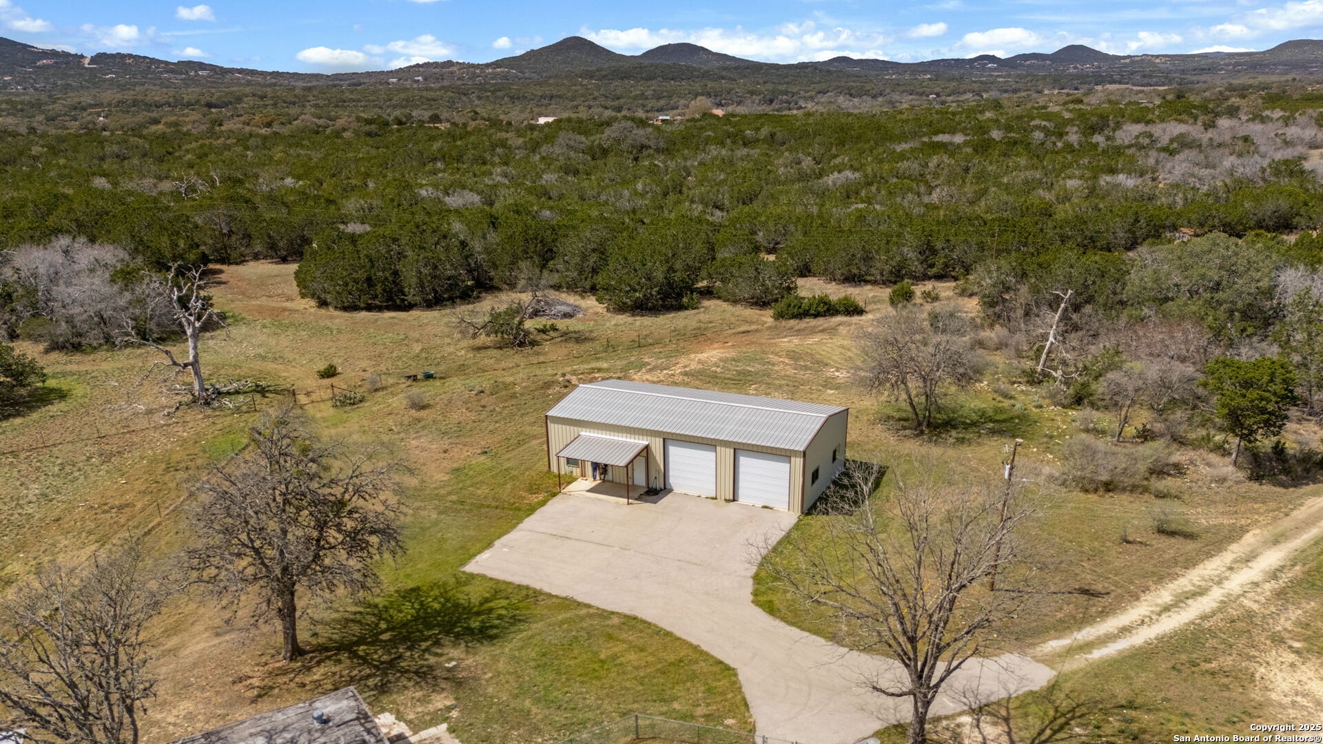 3584 Privilege Creek Road Pipe Creek, TX 78063 - Photo 16 of 66 a view of a house with a yard