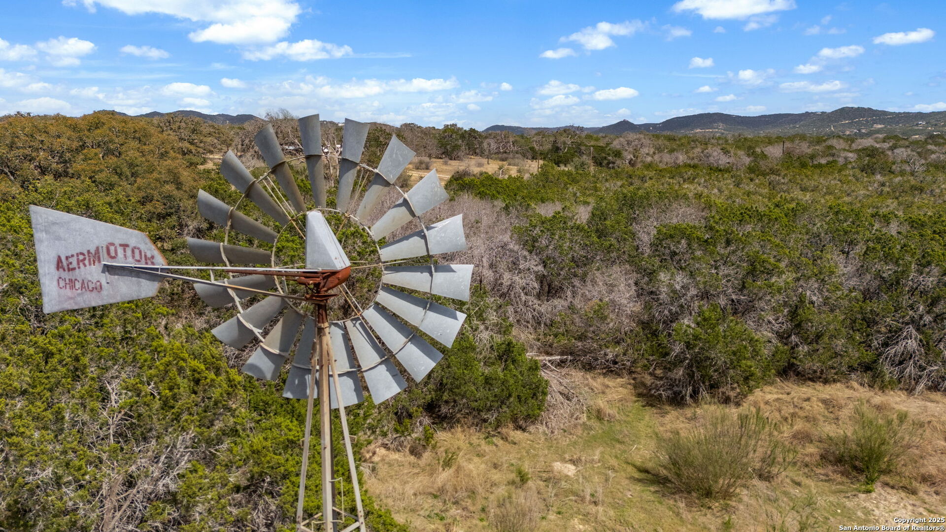 3584 Privilege Creek Road Pipe Creek, TX 78063 - Photo 20 of 66 a view of a city with a mountain