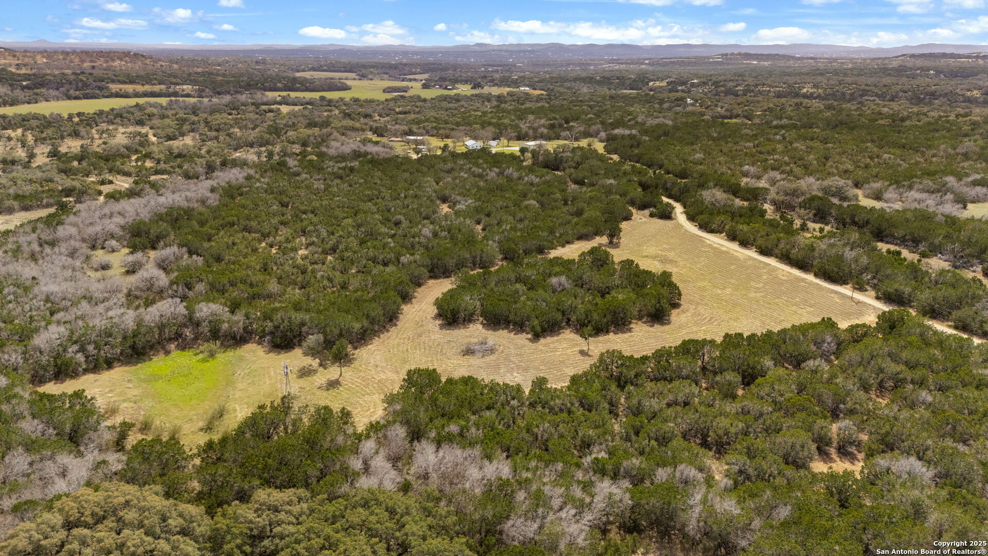 3584 Privilege Creek Road Pipe Creek, TX 78063 - Photo 30 of 66 a view of a houses with a lake