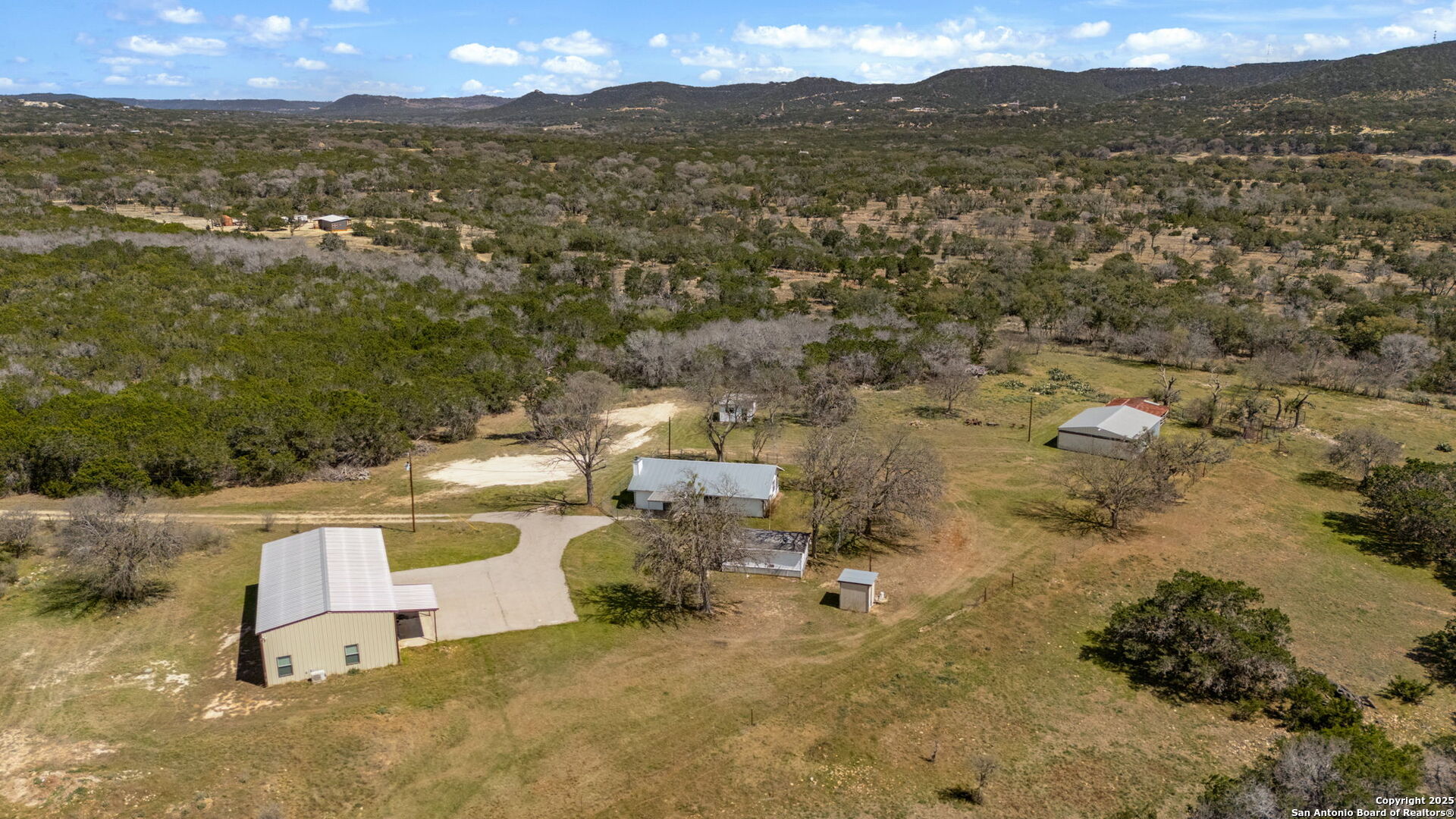 3584 Privilege Creek Road Pipe Creek, TX 78063 - Photo 3 of 66 a view of a lake with a mountain