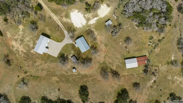 a view of a house with a yard and garage