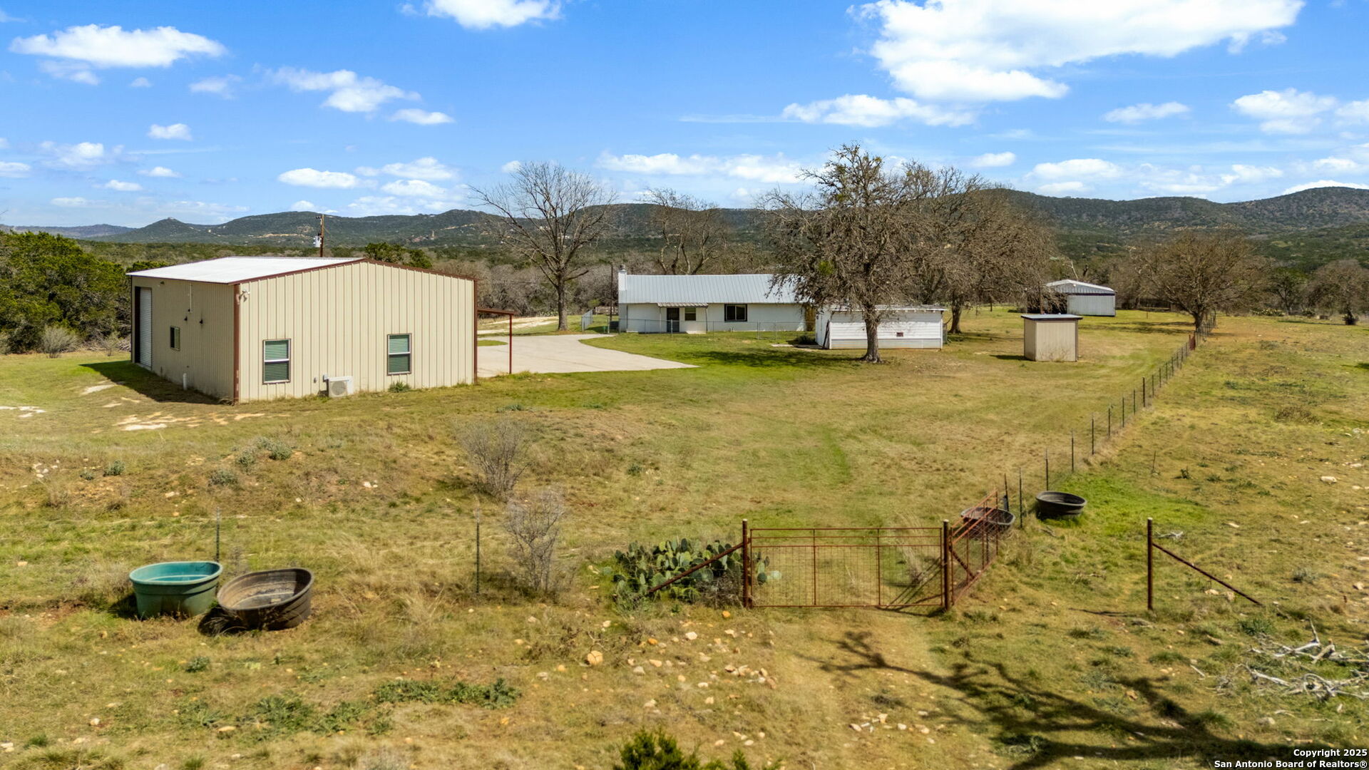 3584 Privilege Creek Road Pipe Creek, TX 78063 - Photo 41 of 66 a view of a terrace with a garden and mountain view
