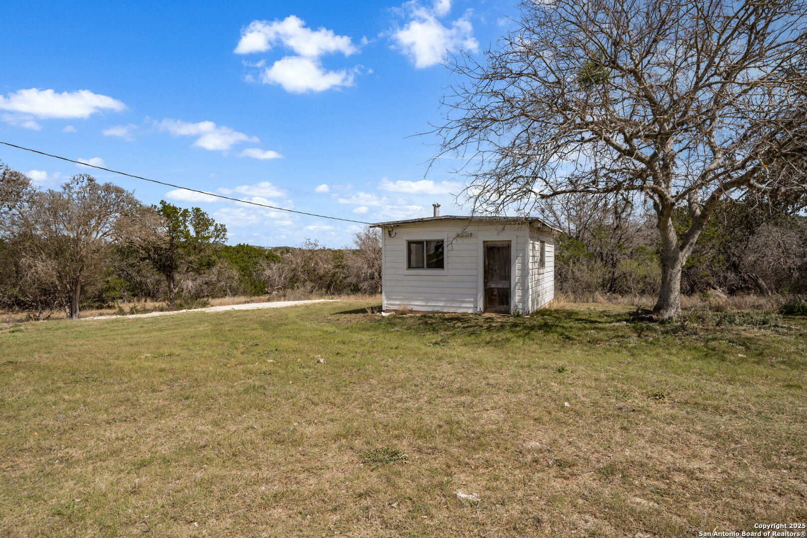 3584 Privilege Creek Road Pipe Creek, TX 78063 - Photo 46 of 66 a view of a house with a yard