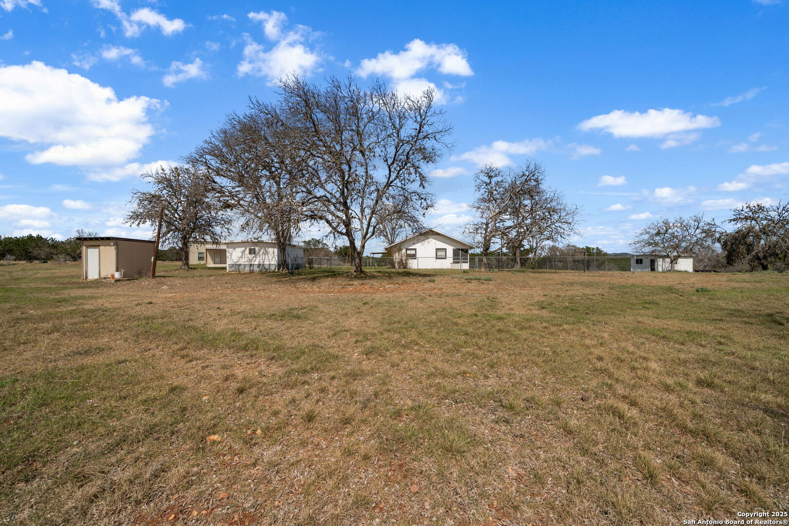 3584 Privilege Creek Road Pipe Creek, TX 78063 - Photo 50 of 66 a view of a yard with a house