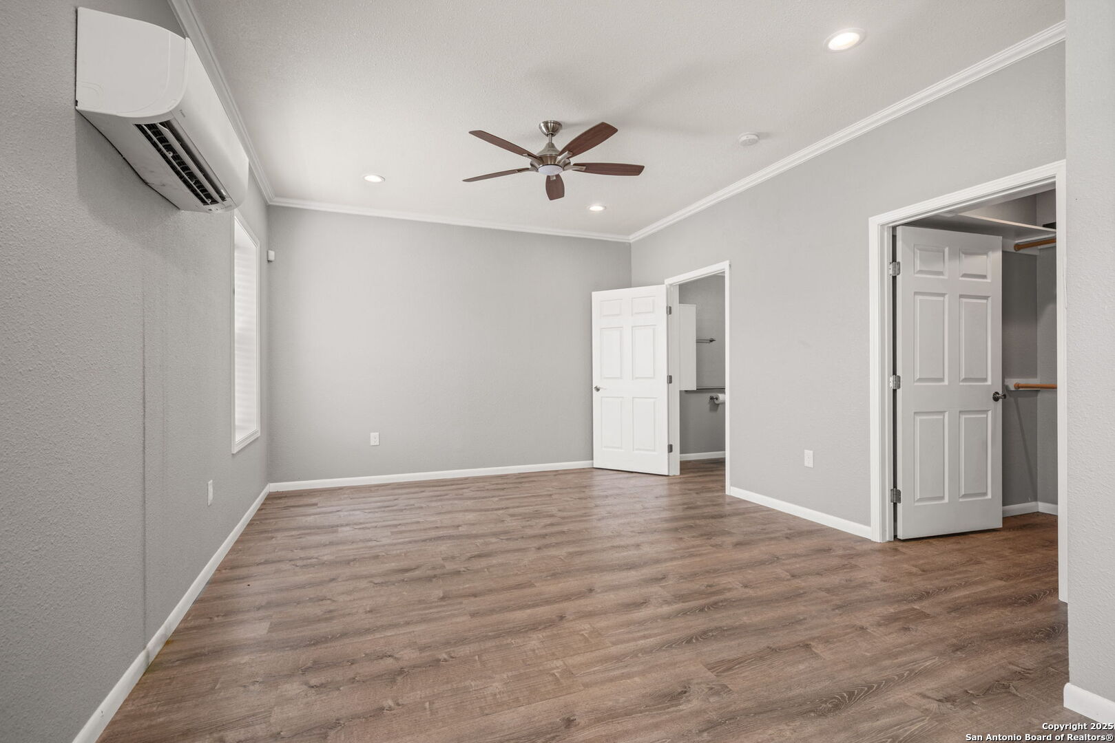 3584 Privilege Creek Road Pipe Creek, TX 78063 - Photo 51 of 66 a view of an empty room with wooden floor and a ceiling fan