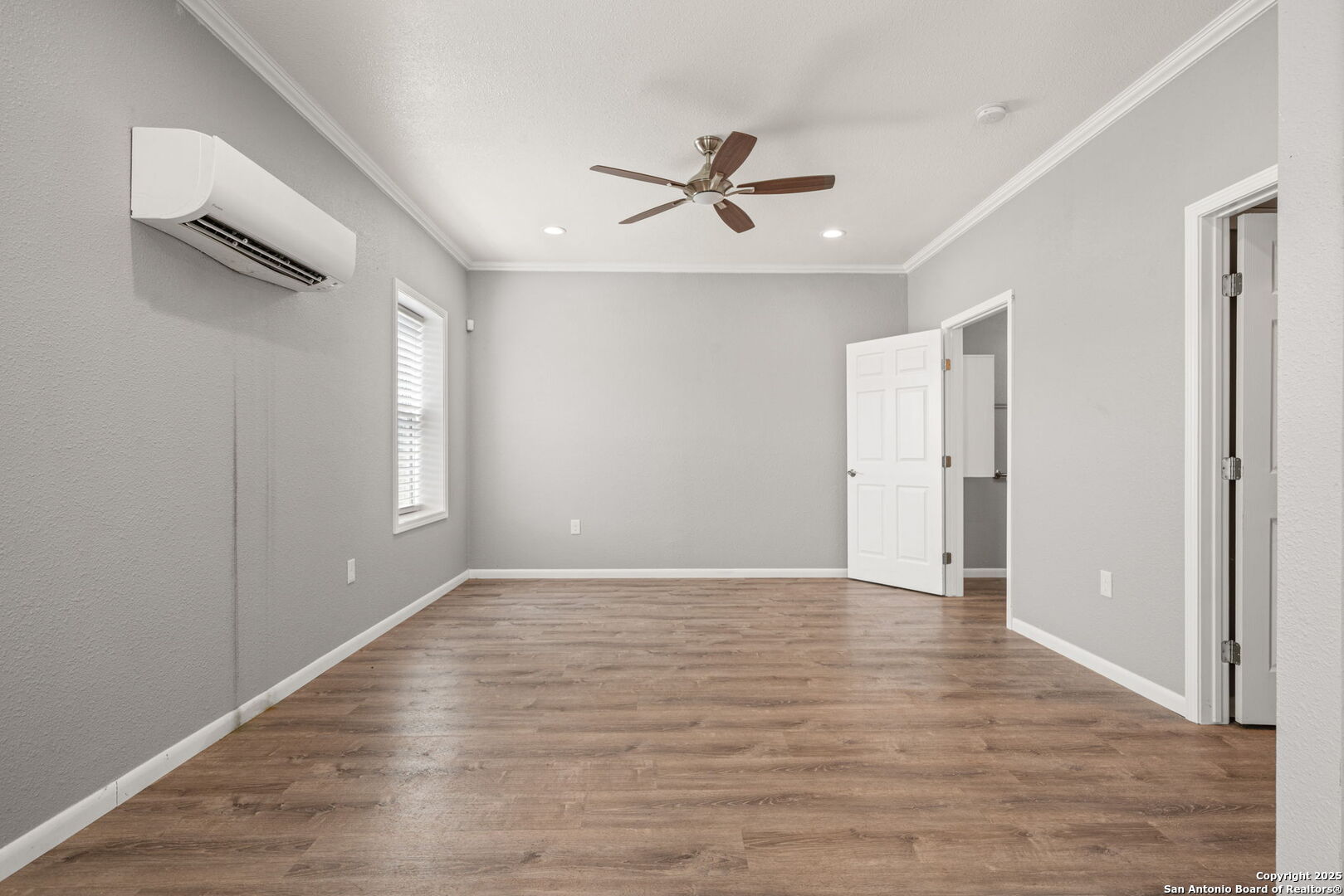 3584 Privilege Creek Road Pipe Creek, TX 78063 - Photo 52 of 66 a view of an empty room with wooden floor and a window
