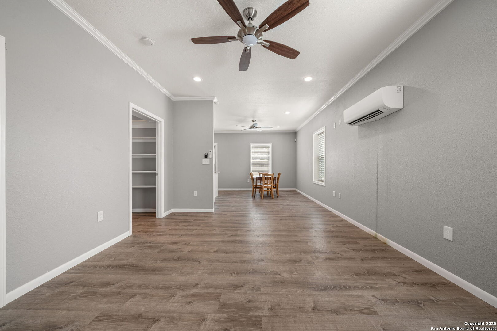 3584 Privilege Creek Road Pipe Creek, TX 78063 - Photo 54 of 66 a view of a livingroom with a ceiling fan and wooden floor
