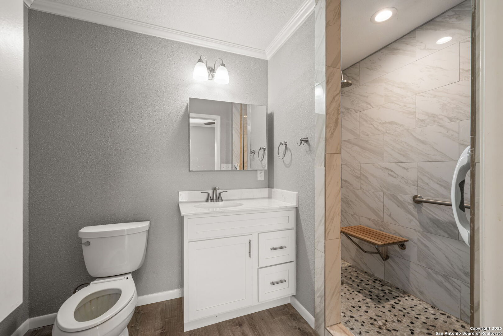 3584 Privilege Creek Road Pipe Creek, TX 78063 - Photo 59 of 66 a bathroom with a toilet sink and a mirror