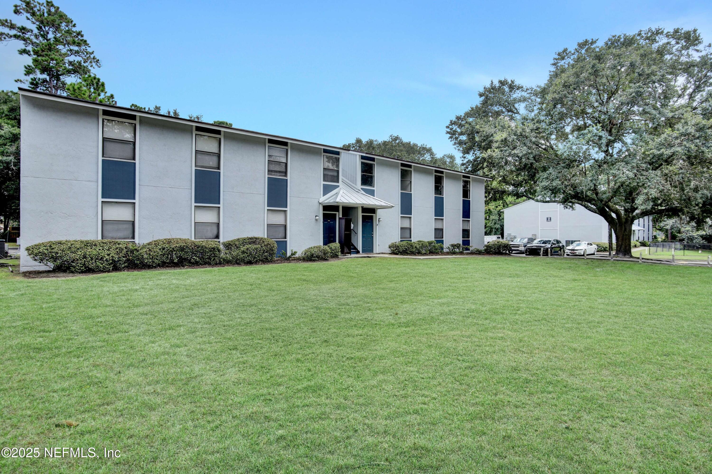 10825 Key Haven Boulevard, Unit 508 Jacksonville, FL 32218 - Photo 11 of 18 a front view of a house with a garden
