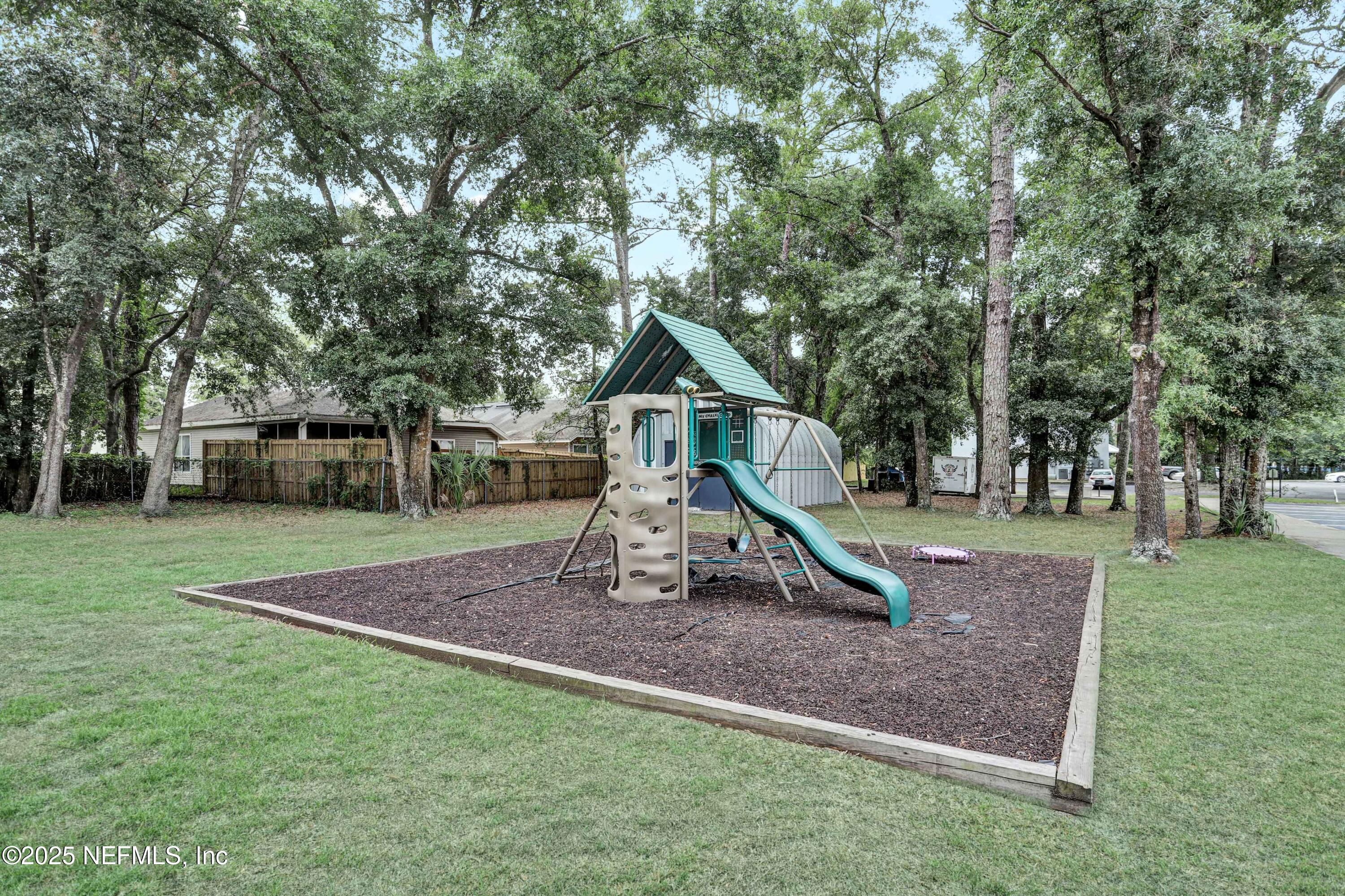 10825 Key Haven Boulevard, Unit 508 Jacksonville, FL 32218 - Photo 13 of 18 a front view of a house with a yard