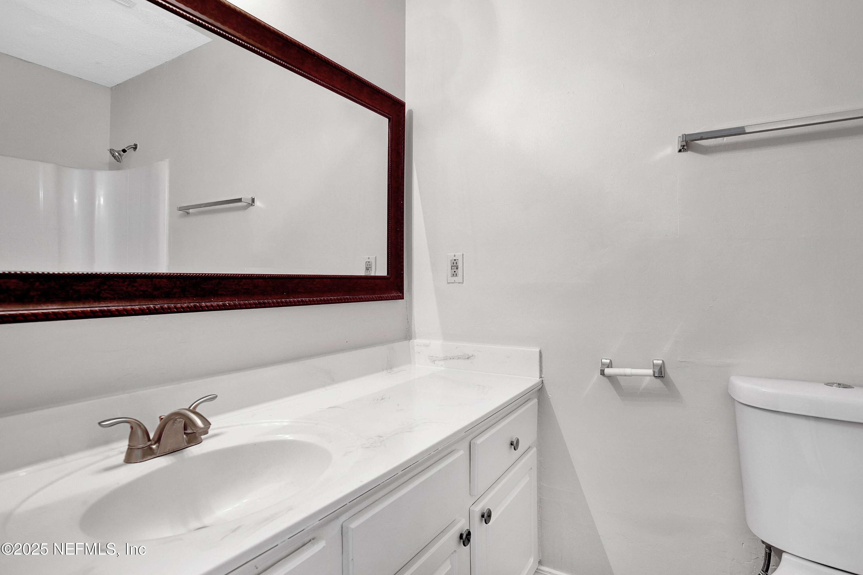 10825 Key Haven Boulevard, Unit 508 Jacksonville, FL 32218 - Photo 8 of 18 a bathroom with a sink and a mirror
