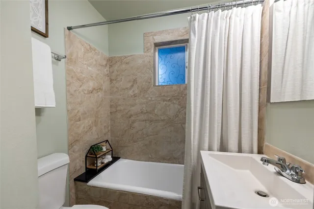 a bathroom with a sink and a bathtub