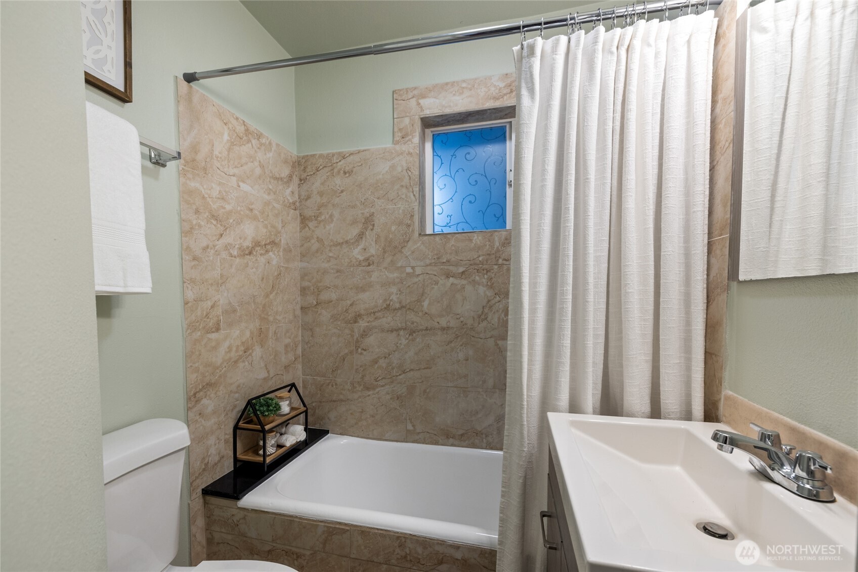 4011 East I Street Tacoma, WA 98404 - Photo 13 of 33 a bathroom with a sink and a bathtub
