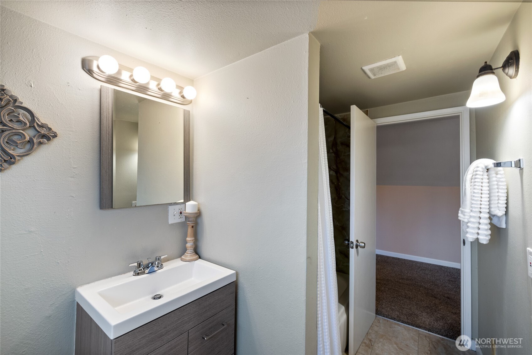 4011 East I Street Tacoma, WA 98404 - Photo 24 of 33 a bathroom with a sink and a mirror