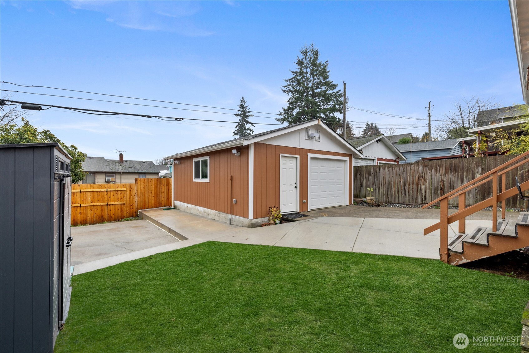 4011 East I Street Tacoma, WA 98404 - Photo 26 of 33 a view of a backyard with plants and a patio