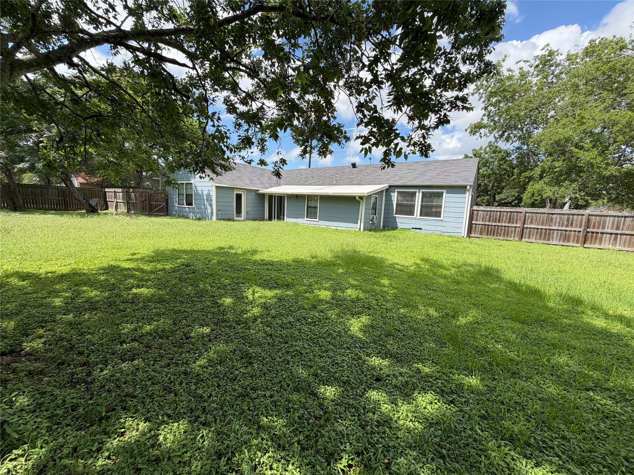 1401 East 29th Street Bryan, TX 77802 - Photo 11 of 13 An inviting backyard oasis offers ample green space for outdoor activities and relaxation.
