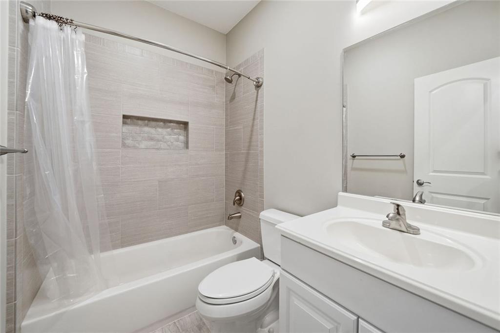 1006 Owens Store Road Canton, GA 30115 - Photo 30 of 48 a bathroom with a sink toilet and shower
