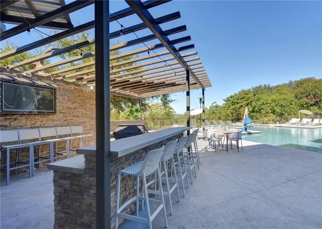 a view of an outdoor sitting area with furniture and garden view