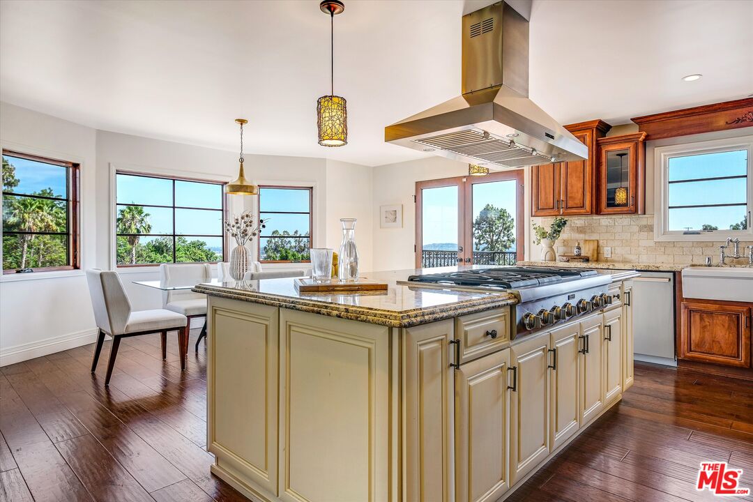 1405 Mayapan Road La Habra Heights, CA 90631 - Photo 14 of 54 a kitchen with stainless steel appliances granite countertop a stove and a wooden floors