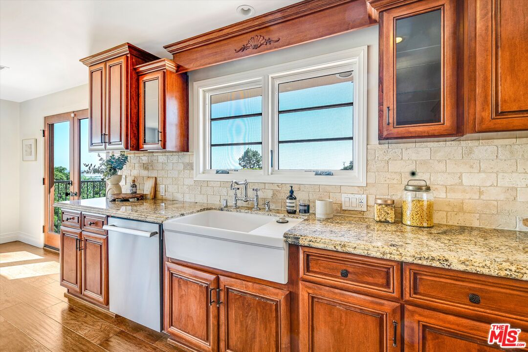 1405 Mayapan Road La Habra Heights, CA 90631 - Photo 16 of 54 a kitchen with granite countertop a sink stove and cabinets