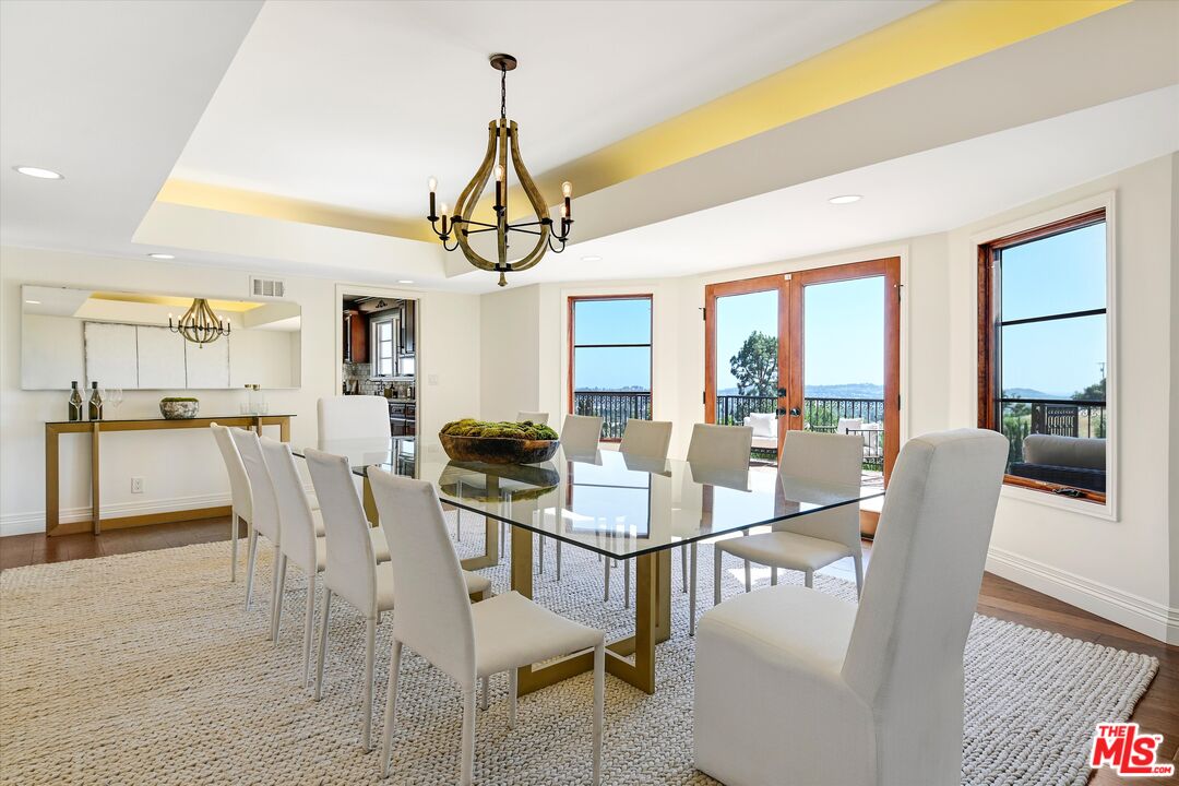 1405 Mayapan Road La Habra Heights, CA 90631 - Photo 19 of 54 a view of a dining room and livingroom with furniture wooden floor a chandelier