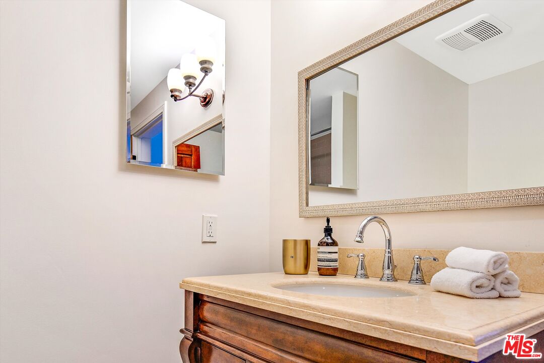 1405 Mayapan Road La Habra Heights, CA 90631 - Photo 23 of 54 a bathroom with a sink and a mirror