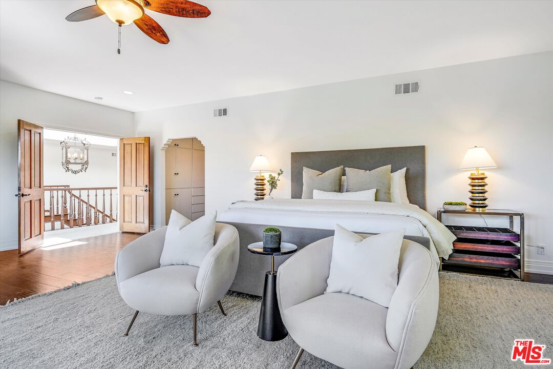 1405 Mayapan Road La Habra Heights, CA 90631 - Photo 25 of 54 a bedroom with a bed a couch and a chandelier
