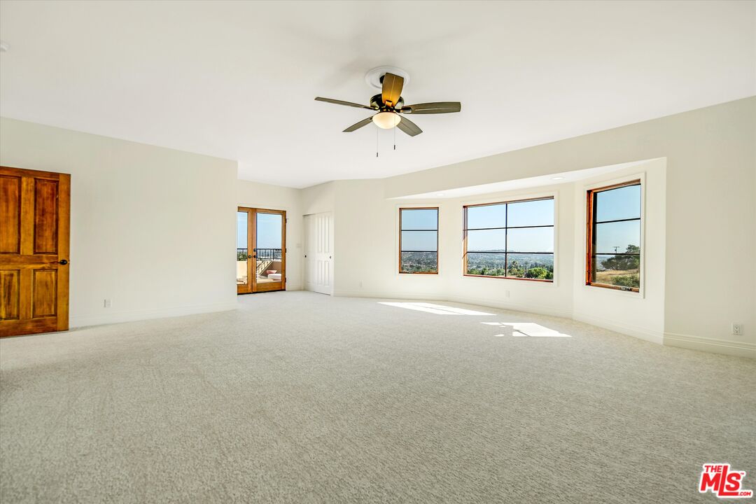 1405 Mayapan Road La Habra Heights, CA 90631 - Photo 35 of 54 a view of a livingroom with a ceiling fan and window