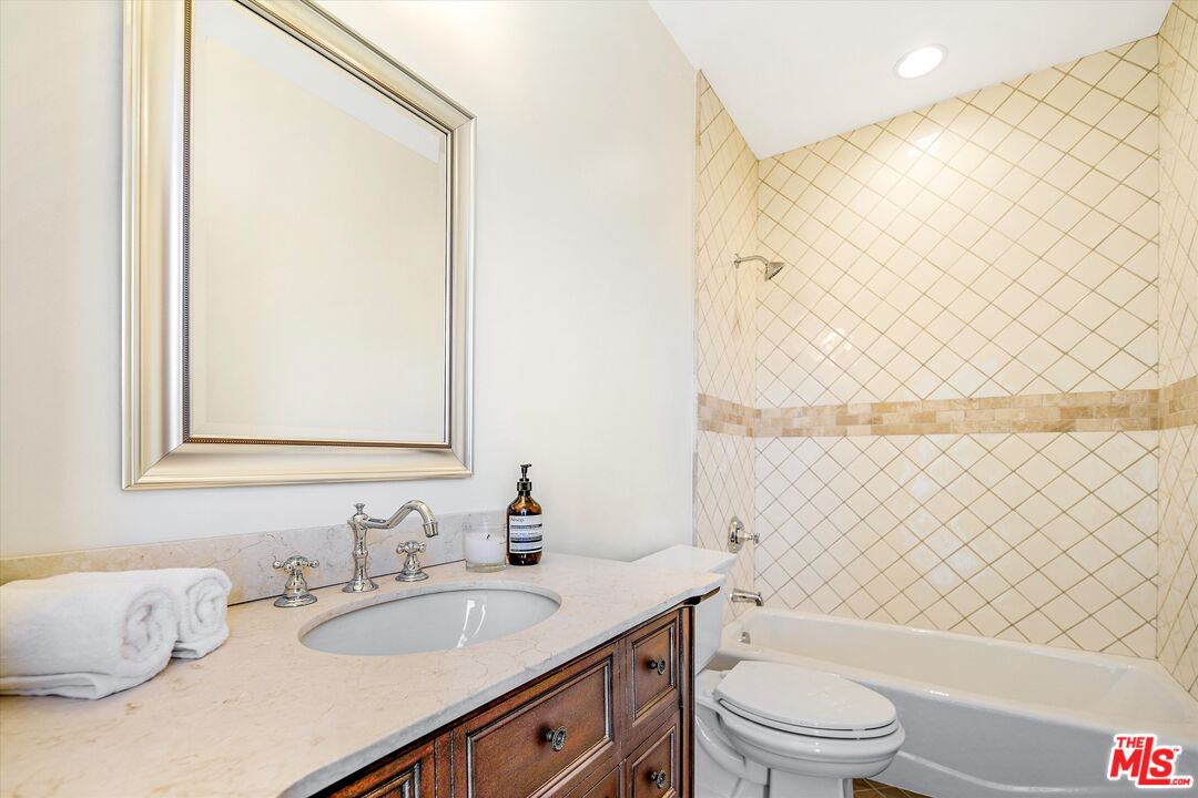 1405 Mayapan Road La Habra Heights, CA 90631 - Photo 37 of 54 a bathroom with a granite countertop sink toilet and shower