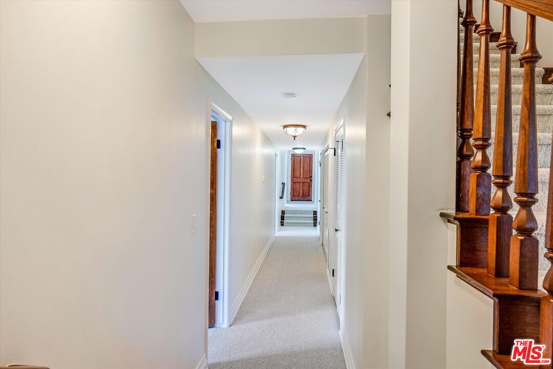 1405 Mayapan Road La Habra Heights, CA 90631 - Photo 38 of 54 a view of a hallway with paintings on the wall