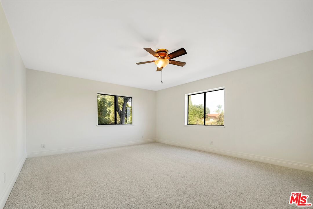 1405 Mayapan Road La Habra Heights, CA 90631 - Photo 39 of 54 an empty room with window and ceiling fan